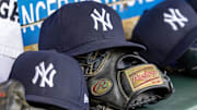 Apr 7, 2025; Detroit, Michigan, USA; New York Yankees baseball hats and gloves in the dugout out in the eighth inning against the Detroit Tigers at Comerica Park. 