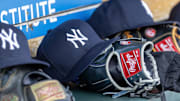 Apr 7, 2025; Detroit, Michigan, USA; New York Yankees baseball hats and gloves in the dugout out in the eighth inning against the Detroit Tigers at Comerica Park. Mandatory Credit: David Reginek-Imagn Images