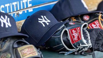 Apr 7, 2025; Detroit, Michigan, USA; New York Yankees baseball hats and gloves in the dugout out in the eighth inning against the Detroit Tigers at Comerica Park. Mandatory Credit: David Reginek-Imagn Images