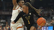 Vanderbilt Commodores guard Mikayla Blakes (1) drives to the basket against Texas Longhorns guard Rori Harmon (3) during the first half at Moody Center.