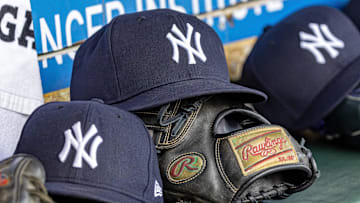 Apr 7, 2025; Detroit, Michigan, USA; New York Yankees baseball hats and gloves in the dugout out in the eighth inning against the Detroit Tigers at Comerica Park. Mandatory Credit: David Reginek-Imagn Images