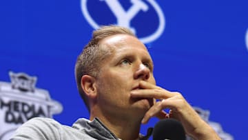 Oct 22, 2025; Kansas City, MO, USA; BYU head coach Kevin Young watches a film clip during Big 12 Menís Basketball media day at T-Mobile Center. Mandatory Credit: Sophia Scheller-Imagn Images