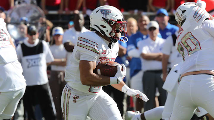 Cameron Dickey (center) had 145 yards of total offense in the Red Raiders’ win vs. BYU on Saturday.