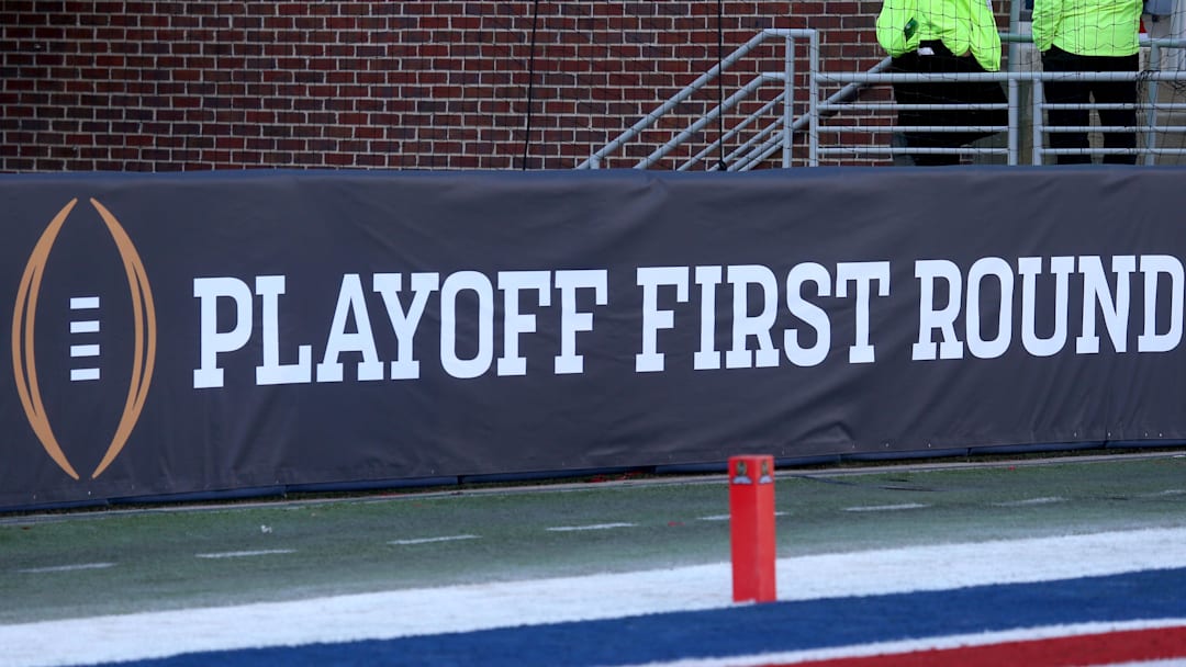 Dec 20, 2025; Oxford, MS, USA; College Football First Round logo on field prior to the game between the Tulane Green Wave and  the Mississippi Rebels at Vaught-Hemingway Stadium. Mandatory Credit: Petre Thomas-Imagn Images