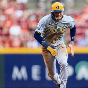 Milwaukee Brewers second baseman Brice Turang (2) runs to third on a single hit by designated hitter William Contreras (not pictured) in the first inning against the Cincinnati Reds at Great American Ball Park in August 2024.