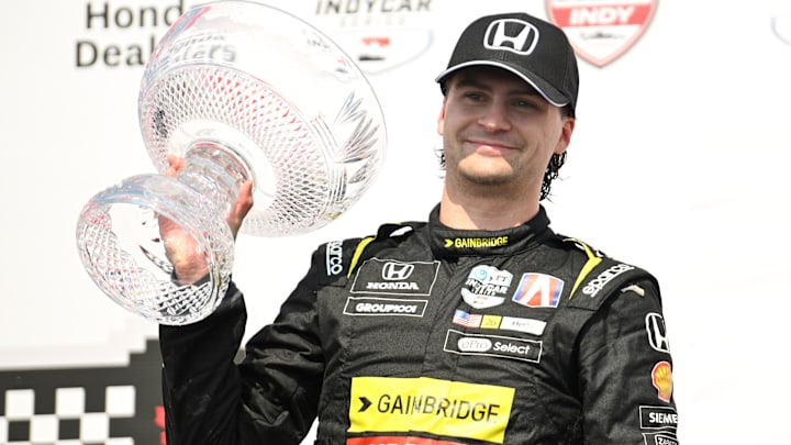 Jul 21, 2024; Toronto, Ontario, CAN;  Andretti Global driver Colton Herta (26) holds the crystal trophy after winning the Honda Dealers Indy at Streets of Toronto. Mandatory Credit: Dan Hamilton-Imagn Images