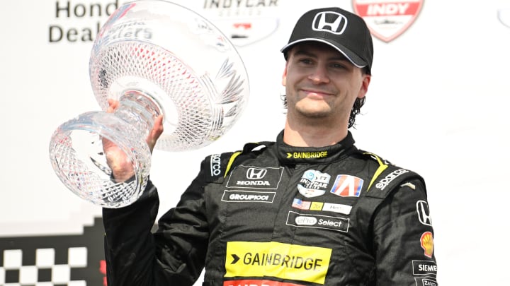 Jul 21, 2024; Toronto, Ontario, CAN;  Andretti Global driver Colton Herta (26) holds the crystal trophy after winning the Honda Dealers Indy at Streets of Toronto. Mandatory Credit: Dan Hamilton-USA TODAY Sports