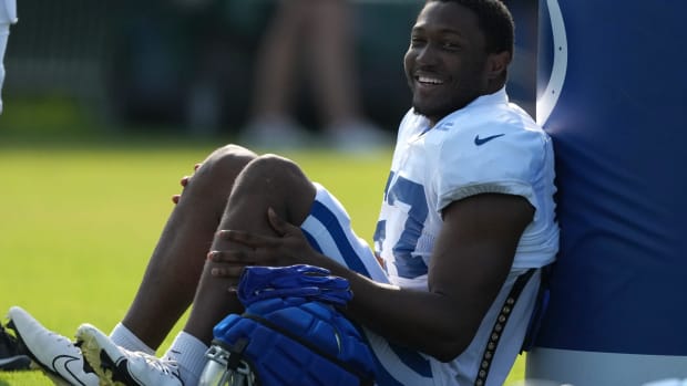 Jaylon Carlies (57) sits before practice begins during training camp Tuesday, July 30, 2024, at Grand Park Sports Complex in 