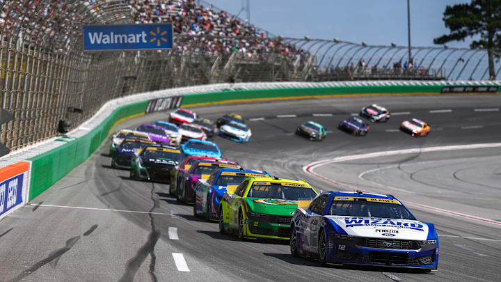 Sep 8, 2024; Hampton, Georgia, USA; NASCAR Cup Series driver Ryan Blaney (12) leads coming down the stretch after turn four at Atlanta Motor Speedway. 