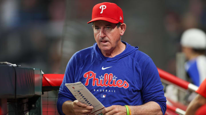 Aug 21, 2024; Atlanta, Georgia, USA; Philadelphia Phillies manager Rob Thomson (59) in the dugout against the Atlanta Braves in the sixth inning at Truist Park