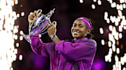 Coco Gauff holds the trophy after winning the 2024 WTA Finals.