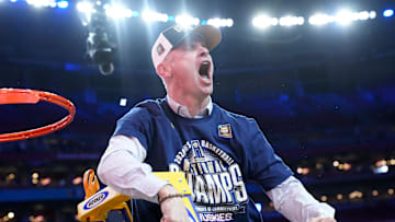 Connecticut Huskies head coach Dan Hurley cuts down the cut after defeating the Purdue Boilermakers in the national championship game of the 2024 NCAA Tournament at State Farm Stadium in Glendale on April 8, 2024.