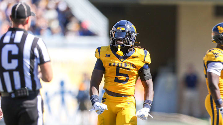 Aug 30, 2025; Morgantown, West Virginia, USA; West Virginia Mountaineers safety Fred Perry (5) celebrates after a tackle for loss during the second quarter against the Robert Morris Colonials at Milan Puskar Stadium. Mandatory Credit: Ben Queen-Imagn Images