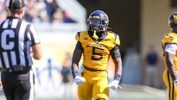 Aug 30, 2025; Morgantown, West Virginia, USA; West Virginia Mountaineers safety Fred Perry (5) celebrates after a tackle for loss during the second quarter against the Robert Morris Colonials at Milan Puskar Stadium. Mandatory Credit: Ben Queen-Imagn Images