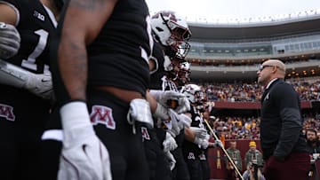 Nov 1, 2025; Minneapolis, Minnesota, USA; Minnesota Golden Gophers head coach P.J. Fleck leads his team onto the field before the game against the Michigan State Spartans at Huntington Bank Stadium. Mandatory Credit: Matt Krohn-Imagn Images