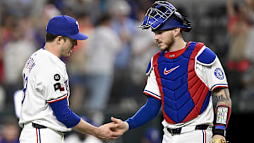 Texas Rangers relief pitcher Phil Maton (88) and catcher Jonah Heim (28) celebrate the win against the Minnesota Twins at Globe Life Field. 