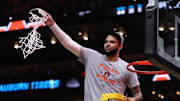 Mar 30, 2025; Atlanta, GA, USA; Auburn Tigers forward Johni Broome (4) cuts down the net after winning the South Regional final of the 2025 NCAA tournament against the Michigan State Spartans at State Farm Arena. Mandatory Credit: Brett Davis-Imagn Images