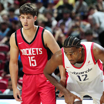 Jul 14, 2024; Las Vegas, NV, USA; Houston Rockets guard Reed Sheppard (15) and Washington Wizards forward Alex Sarr (12) await a free throw attempt during the second quarter at Thomas & Mack Center. Mandatory Credit: Stephen R. Sylvanie-Imagn Images