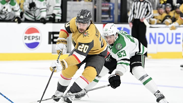 Apr 27, 2024; Las Vegas, Nevada, USA; Vegas Golden Knights center Chandler Stephenson (20) battles for the puck with Dallas Stars center Wyatt Johnston (53) in the third period in game three of the first round of the 2024 Stanley Cup Playoffs at T-Mobile Arena. Mandatory Credit: Candice Ward-USA TODAY Sports