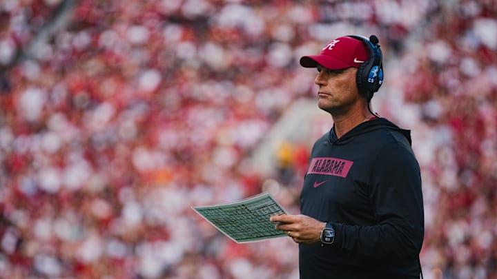 Sep 7, 2024; Tuscaloosa, Alabama, USA;  Alabama Crimson Tide head coach Kalen DeBoer reviews a checklist during a timeout in the first quarter at Bryant-Denny Stadium. Mandatory Credit: William McLelland-Imagn Images