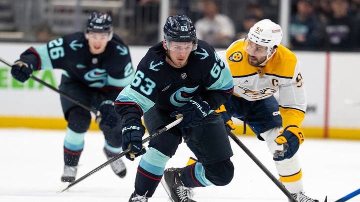 Mar 10, 2026; Seattle, Washington, USA; Seattle Kraken forward Jacob Melanson (63) skates against Nashville Predators defenseman Roman Josi (59) during the second period at Climate Pledge Arena. Mandatory Credit: Stephen Brashear-Imagn Images
