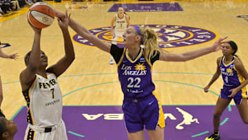 May 24, 2024; Los Angeles, California, USA;  Los Angeles Sparks forward Cameron Brink (22) blocks a shot by Indiana Fever forward Aliyah Boston (7) in the first half at Crypto.com Arena. Mandatory Credit: Jayne Kamin-Oncea-Imagn Images