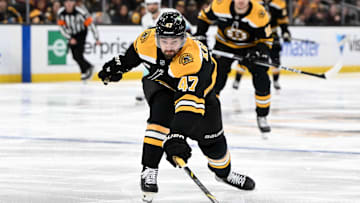 Nov 3, 2024; Boston, Massachusetts, USA; Boston Bruins center Mark Kastelic (47) reaches for a puck against the Seattle Kraken during the third period at the TD Garden. Mandatory Credit: Brian Fluharty-Imagn Images