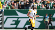  Aaron Rodgers (8) runs off the field during the second half against the New York Jets at MetLife Stadium. 