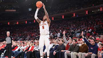 Feb 1, 2025; New York, New York, USA;  St. John's Red Storm guard Deivon Smith (5) takes a three point shot in the second half against the Providence Friars at Madison Square Garden. Mandatory Credit: Wendell Cruz-Imagn Images