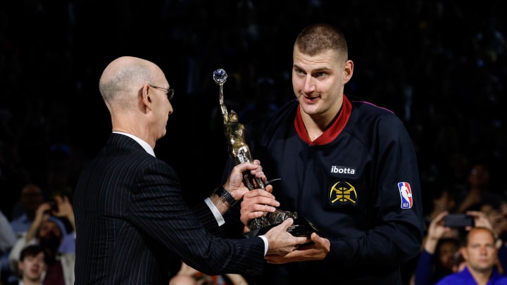 May 14, 2024; Denver, Colorado, USA; NBA commissioner Adam Silver presents Denver Nuggets center Nikola Jokic (15) the KIA NBA MVP trophy before game five against the Minnesota Timberwolves in the second round for the 2024 NBA playoffs at Ball Arena. Mandatory Credit: Isaiah J. Downing-USA TODAY Sports