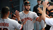 San Francisco Giants relief pitcher Joey Lucchesi (middle) is greeted in the dugout after being relieved from the game during the ninth inning against the Los Angeles Dodgers at Dodger Stadium. 