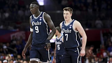Jan 4, 2025; Dallas, Texas, USA;  Duke Blue Devils guard Kon Knueppel (7) and Duke Blue Devils center Khaman Maluach (9) during the first half against the Southern Methodist Mustangs at Moody Coliseum. Mandatory Credit: Kevin Jairaj-Imagn Images