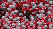 Ohio State coach Ryan Day huddles with his players before facing Maryland.