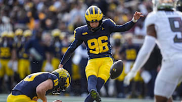 Michigan place kicker Dominic Zvada (96) attempts an extra point against Oregon during the first half at Michigan Stadium in Ann Arbor on Saturday, Nov. 2, 2024.