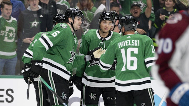 Oct 3, 2023; Dallas, Texas, USA; Dallas Stars defenseman Lian Bichsel (6) and left wing Jason Robertson (21) and center Joe Pavelski (16) celebrates a goal scored by Robertson against the Colorado Avalanche during the second period at the American Airlines Center. Mandatory Credit: Jerome Miron-Imagn Images