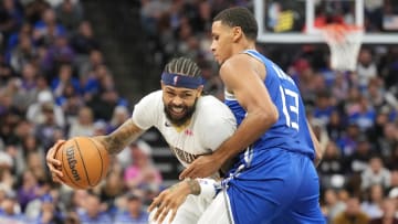 Dec 4, 2023; Sacramento, California, USA; New Orleans Pelicans forward Brandon Ingram (left) dribbles against Sacramento Kings forward Keegan Murray (13) during the fourth quarter at Golden 1 Center. Mandatory Credit: Darren Yamashita-USA TODAY Sports