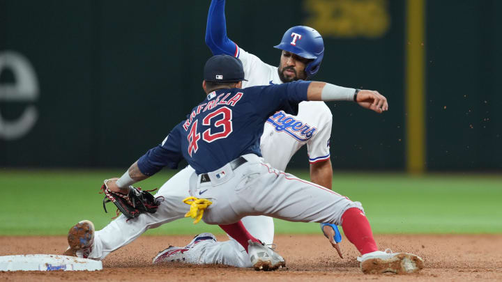 Sep 20, 2023; Arlington, Texas, USA; Texas Rangers second baseman Marcus Semien (2) is forced out at second by Boston Red Sox shortstop Ceddanne Rafaela (43) during the second inning at Globe Life Field. Mandatory Credit: Jim Cowsert-USA TODAY Sports