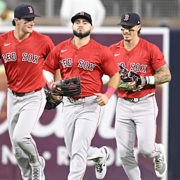 Aug 8, 2025; San Diego, California, USA; Boston Red Sox right fielder Roman Anthony (19), left, Wilyer Abreu (52), center, and Jarren Duran (16) leave the field after the Red Sox beat the San Diego Padres at Petco Park. Mandatory Credit: Denis Poroy-Imagn Images