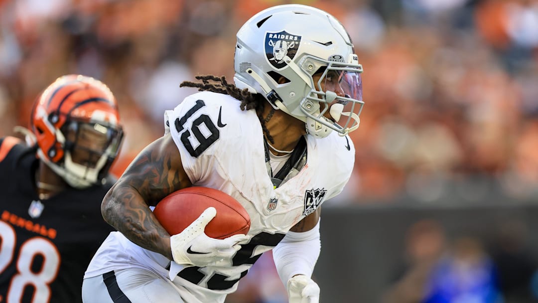 Nov 3, 2024; Cincinnati, Ohio, USA; Las Vegas Raiders wide receiver DJ Turner (19) runs with the ball against the Cincinnati Bengals in the second half at Paycor Stadium. Mandatory Credit: Katie Stratman-Imagn Images