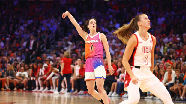 Caitlin Clark (22) shoots for the basket during the first half against USA Women's National Team guard Sabrina Ionescu (6)