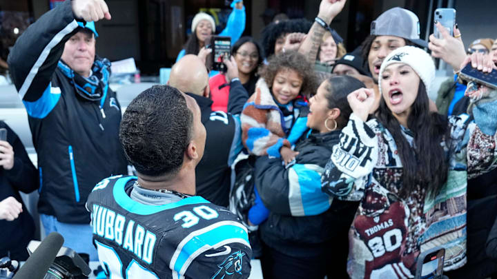 Carolina Panthers running back Chuba Hubbard (30) celebreates with fans