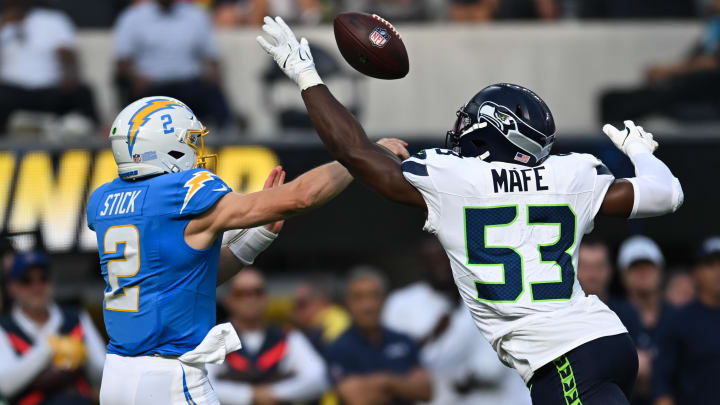 Aug 10, 2024; Inglewood, California, USA; Seattle Seahawks linebacker Boye Mafe (53) blocks a throw from Los Angeles Chargers quarterback Easton Stick (2) during the second quarter at SoFi Stadium. Mandatory Credit: Jonathan Hui-USA TODAY Sports