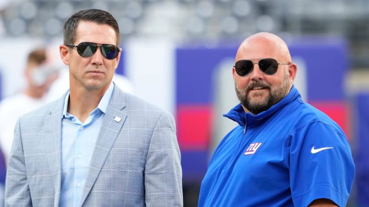 Aug 26, 2023; East Rutherford, New Jersey, USA; New York Giants head coach Brian Daboll (right) and general manager Joe Schoen (left) talk before a game against the New York Jets at MetLife Stadium.  