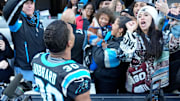 Carolina Panthers running back Chuba Hubbard celebrates with NFL fans after scoring the game winning touchdown in overtime