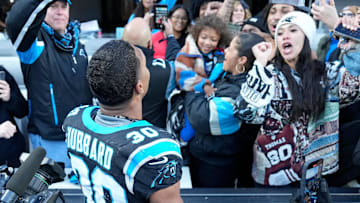 Carolina Panthers running back Chuba Hubbard celebrates with NFL fans after scoring the game winning touchdown in overtime