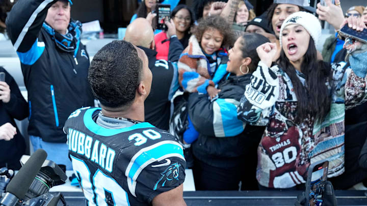 Carolina Panthers running back Chuba Hubbard celebrates with NFL fans after scoring the game winning touchdown in overtime Carolina Panthers running back Chuba Hubbard celebrates with NFL fans after scoring the game winning touchdown in overtime