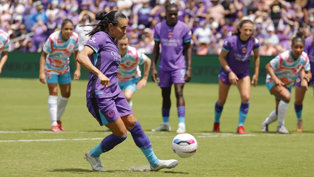 Mar 29, 2025; Orlando, Florida, USA; Orlando Pride forward Marta (10) scores a penalty kick against San Diego Wave FC during the second half at Inter&Co Stadium. Mandatory Credit: Reinhold Matay-Imagn Images
