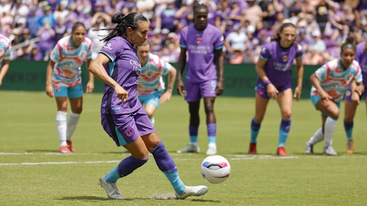 Mar 29, 2025; Orlando, Florida, USA; Orlando Pride forward Marta (10) scores a penalty kick against San Diego Wave FC during the second half at Inter&Co Stadium. Mandatory Credit: Reinhold Matay-Imagn Images