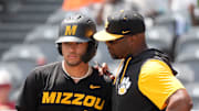 May 20, 2025; Hoover, AL, USA; Missouri hitter Tyler Macon confers with coach Kerrick Jackson during the game with Alabama in the first game of the SEC Baseball Tournament at the Hoover Met.