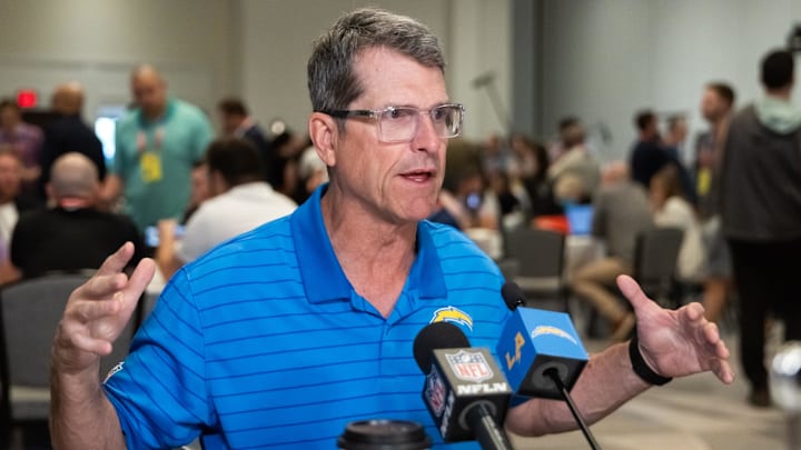 Mar 31, 2026; Phoenix, AZ, USA; Los Angeles Chargers head coach Jim Harbaugh speaks to reporters in the media during the 2026 NFL Annual League Meeting at the Arizona Biltmore. Mandatory Credit: Mark J. Rebilas-Imagn Images